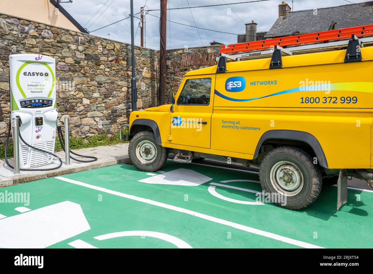 ESB van parked next to an Eir EV charging point in Tramore, Co. Waterford, Ireland. Stock Photo