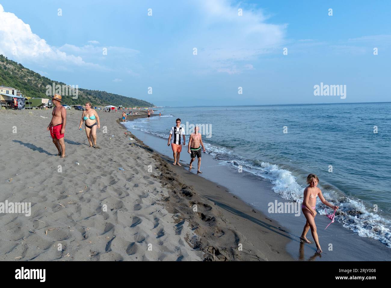 People Are Walking Along The Captivating Rana E Hedhun Beach Where people-are-walking-along-the-captivating-rana-e-hedhun-beach-where