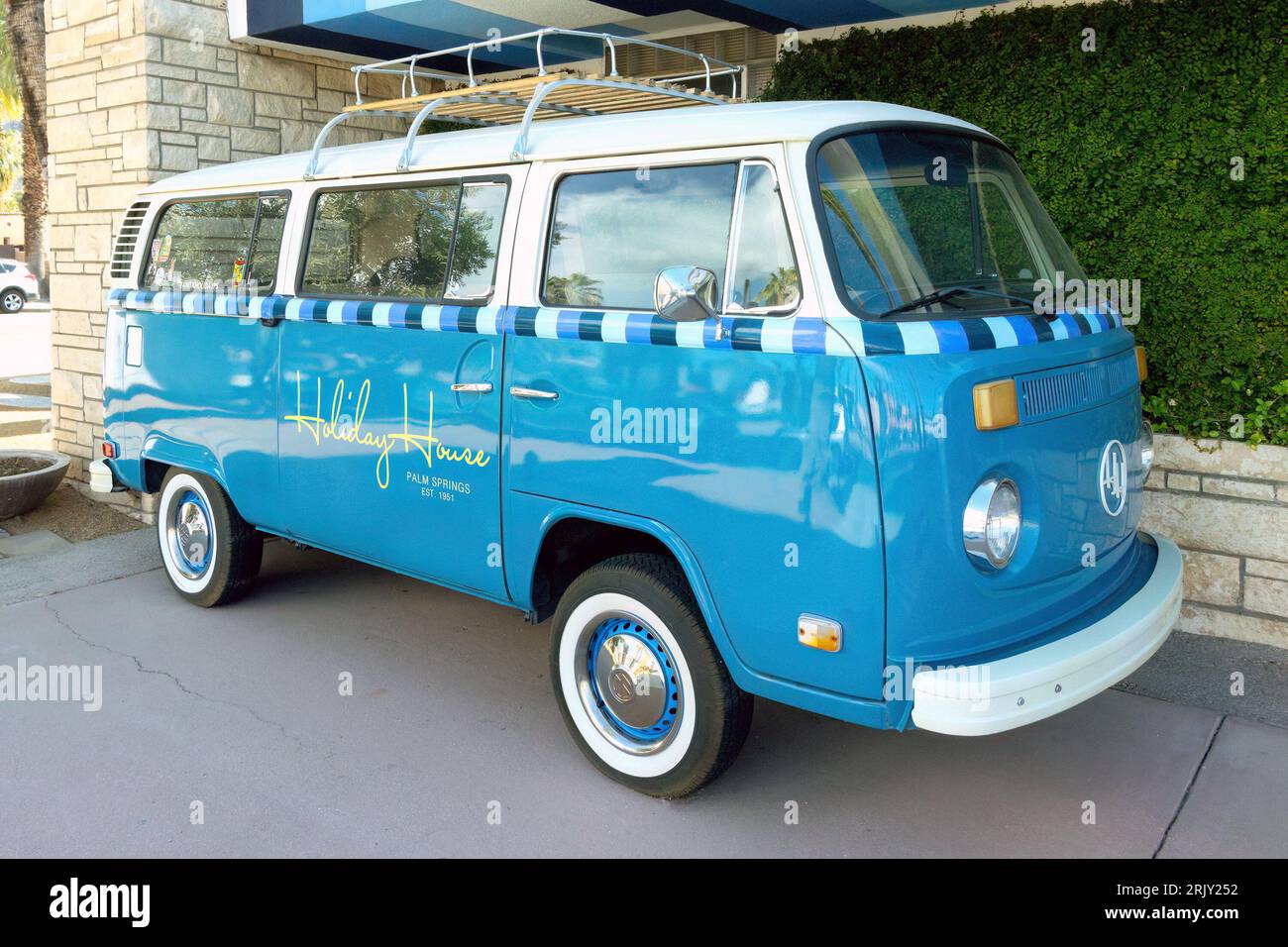 Blue vintage Type 2 VW Volkswagen Kombi in Palm Springs, California, USA branded Holiday House Stock Photo