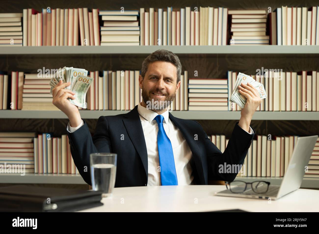 Business man with cash money dollars banknotes Stock Photo - Alamy