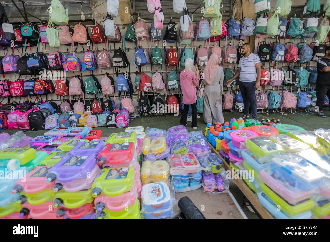 Palestinians seen shopping during the preparation for the new school year at the market in Gaza. Stock Photo