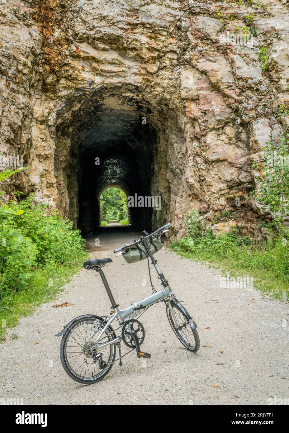 folding bike on Katy Trail at a tunnel near Rocheport Missouri summer scenery. The Katy Trail is 237 mile bike trail converted from an old railroad Stock Photo Alamy
