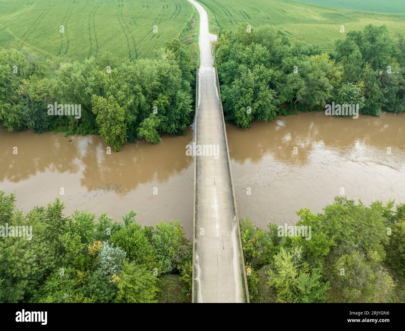road and bridge over flooded Lamine River with floating debris, aerial view at Roberts Bluff access in Missouri Stock Photo