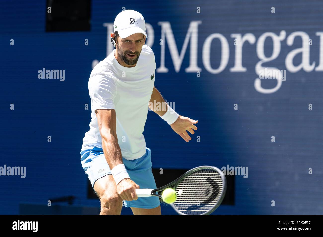 Novak Djokovic of Serbia returns ball during practice for US Open