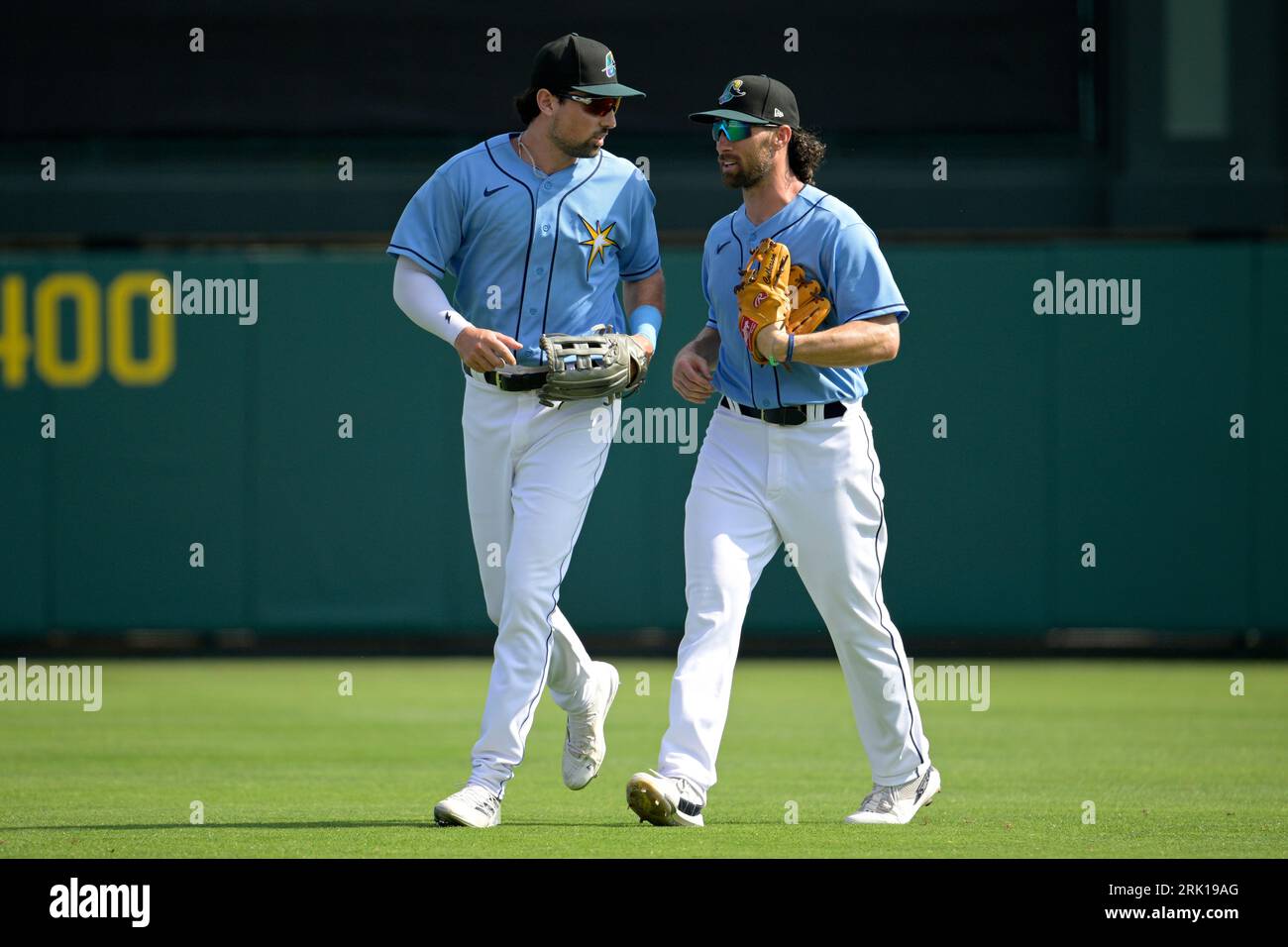 Tampa Bay Rays outfielders Jordan Qsar, left, and Charlie Culberson chat  after Culberson caught a fly ball during the sixth inning of a spring  training baseball game against the New York Yankees
