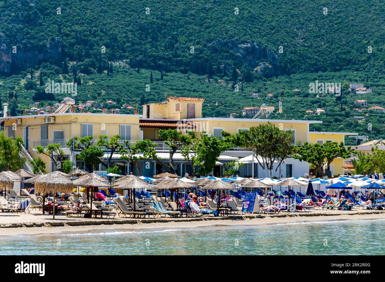 Alykes, Zakynthos, Greece May 19 2023 - Alykes beach with lots of tourists sunbathing Stock Photo