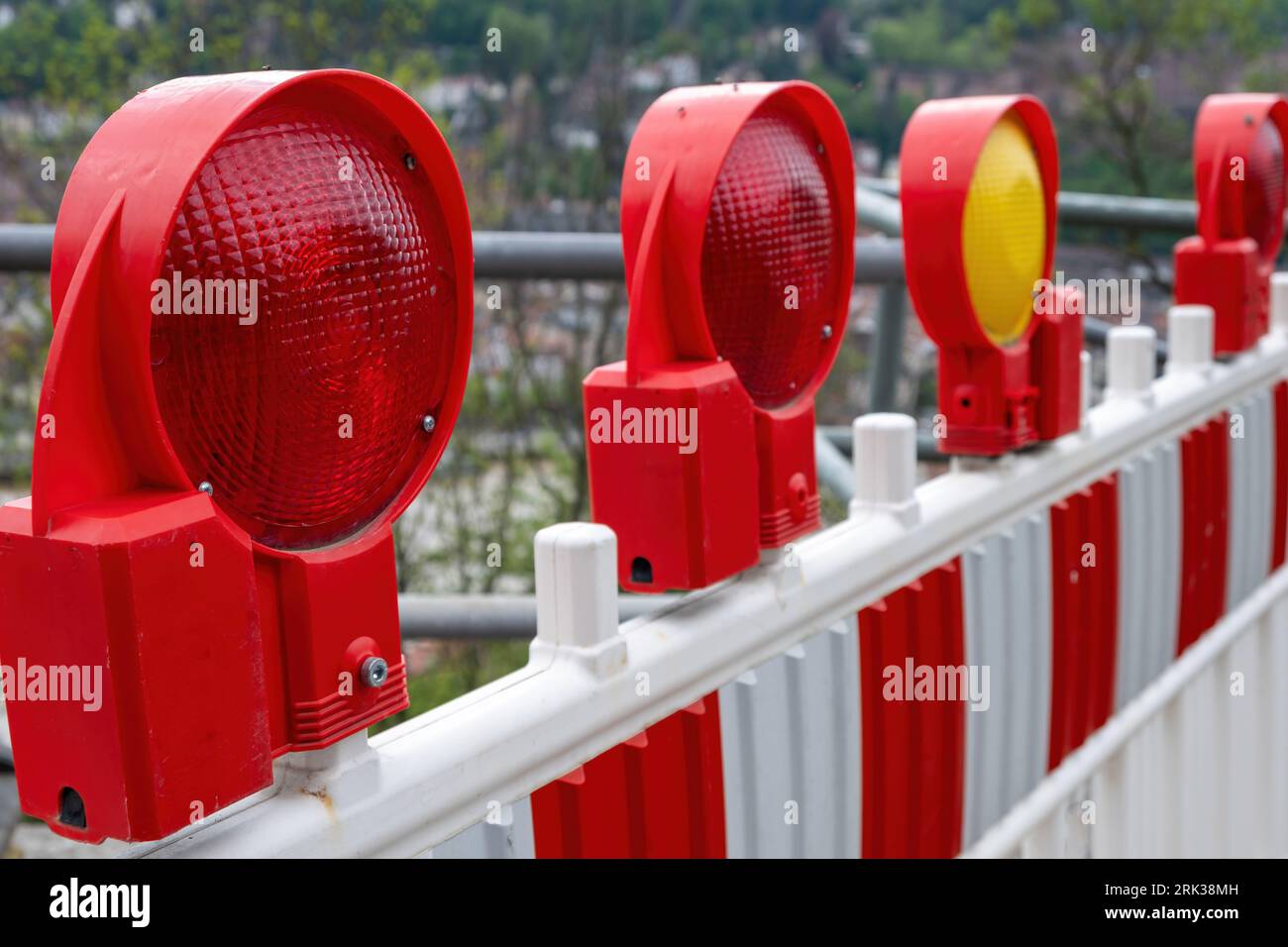 Construction safety. Street barricade with warning signal lamps on a