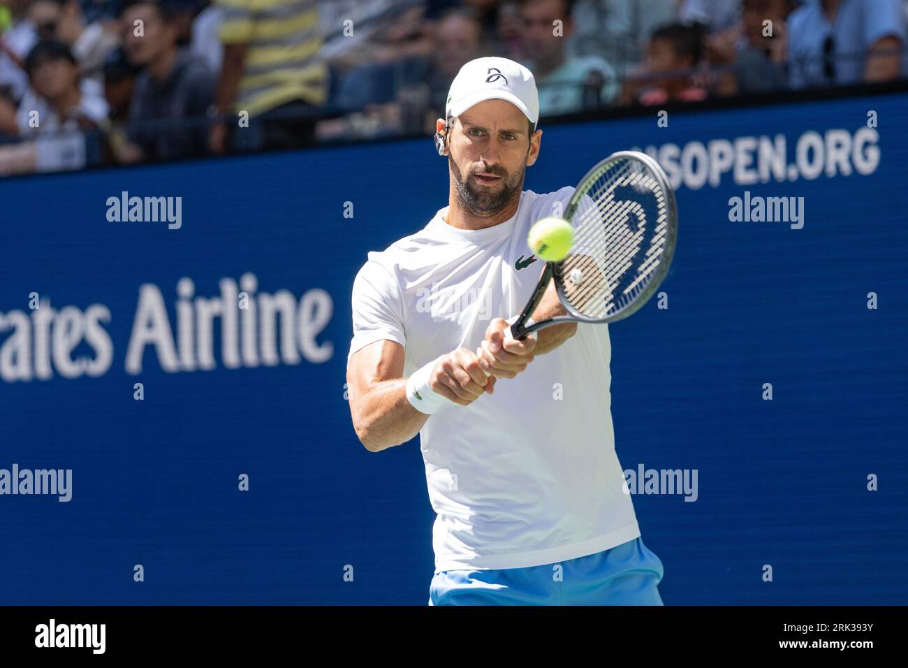 Novak Djokovic of Serbia returns ball during practice for US Open