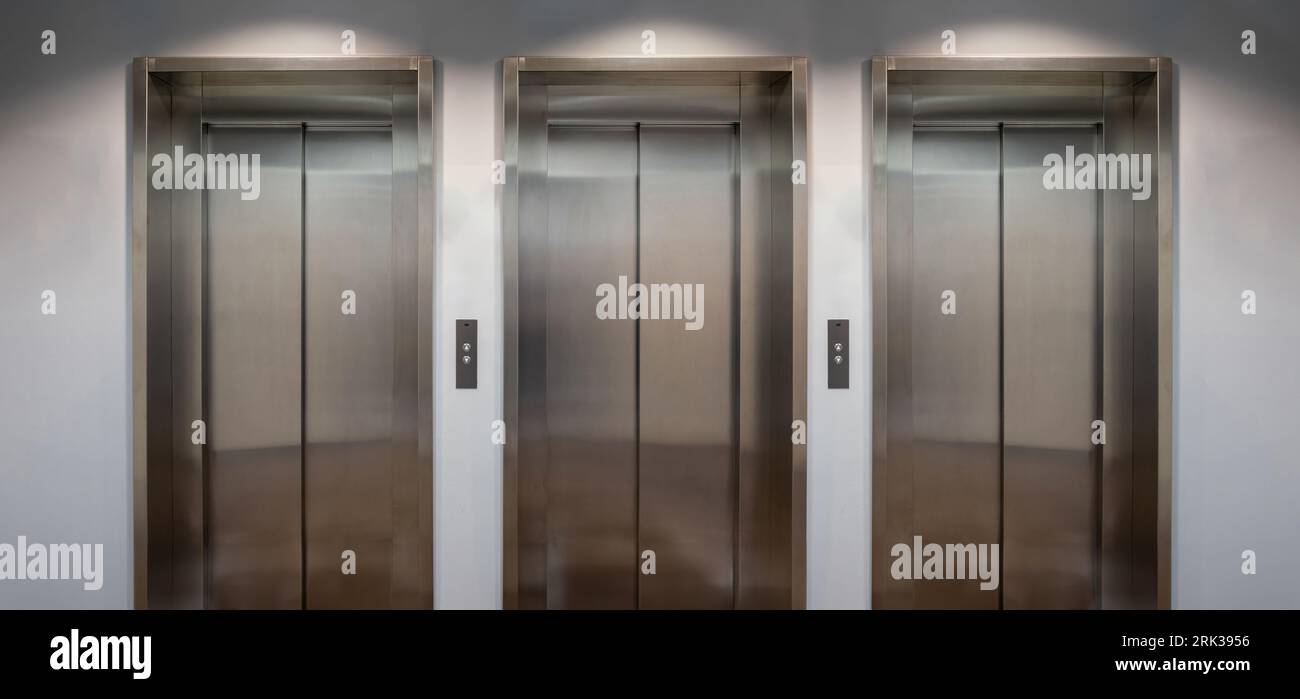 Elevators lobby, Stainless steel lifts with closed doors front view