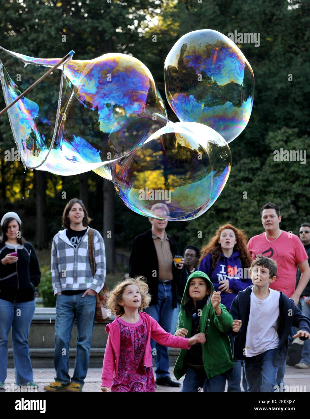 Children and bubbles central park hi-res stock photography and