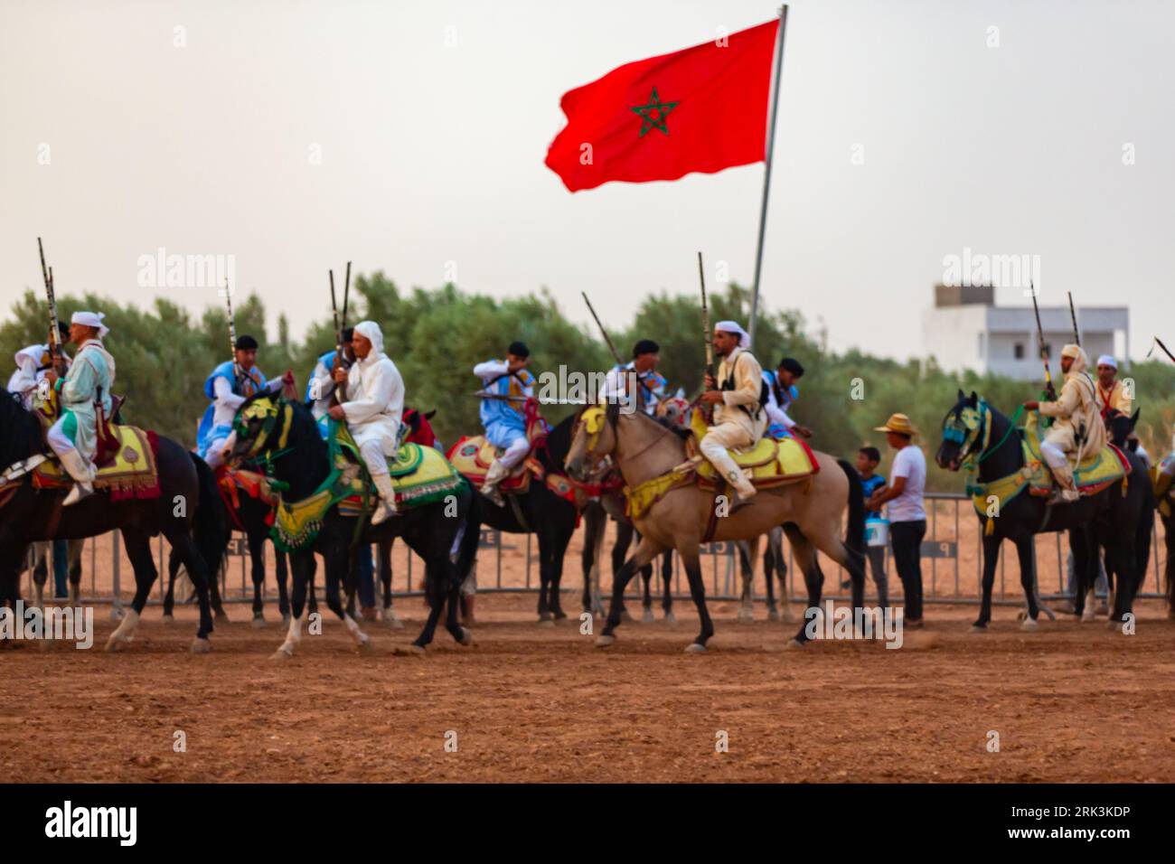Essaouira, Morocco - 13 August 2023 : Equestrians participating in a traditional fancy dress event named Tbourida in Arabic dressed in a traditional M Stock Photo