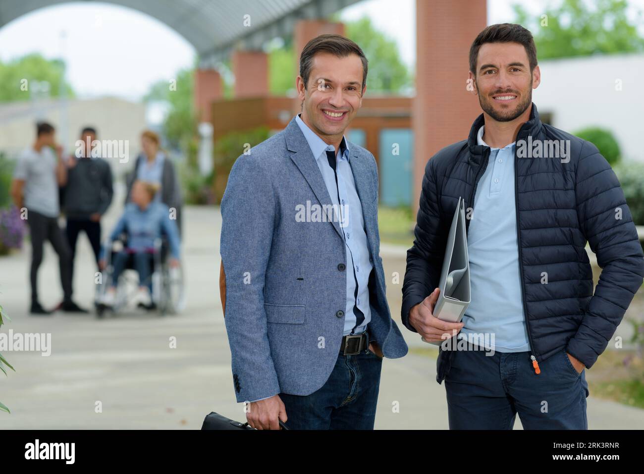 portrait of men outside library Stock Photo - Alamy