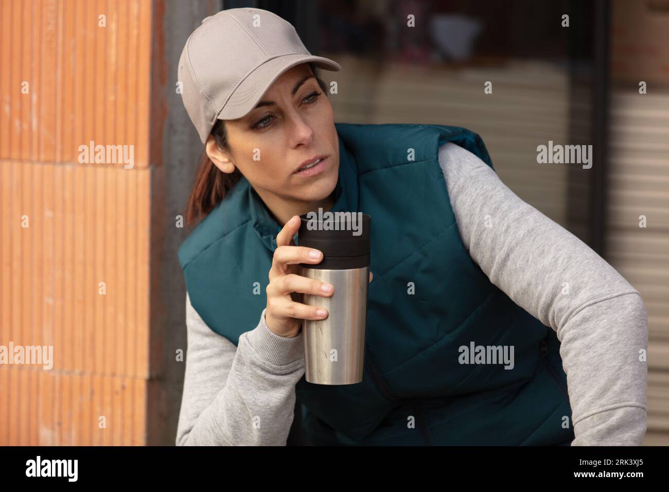 woman worker builder to coffee break Stock Photo