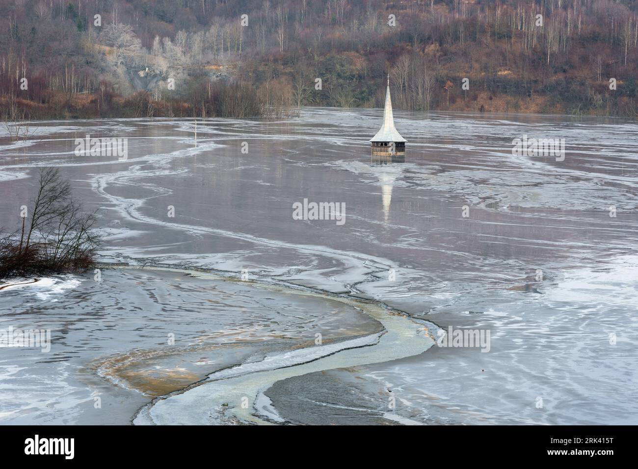 Church flooded and submerged by toxic waste waters from a copper and gold mine. Decantation lake, Geamana, Rosia Montana, Romania Stock Photo