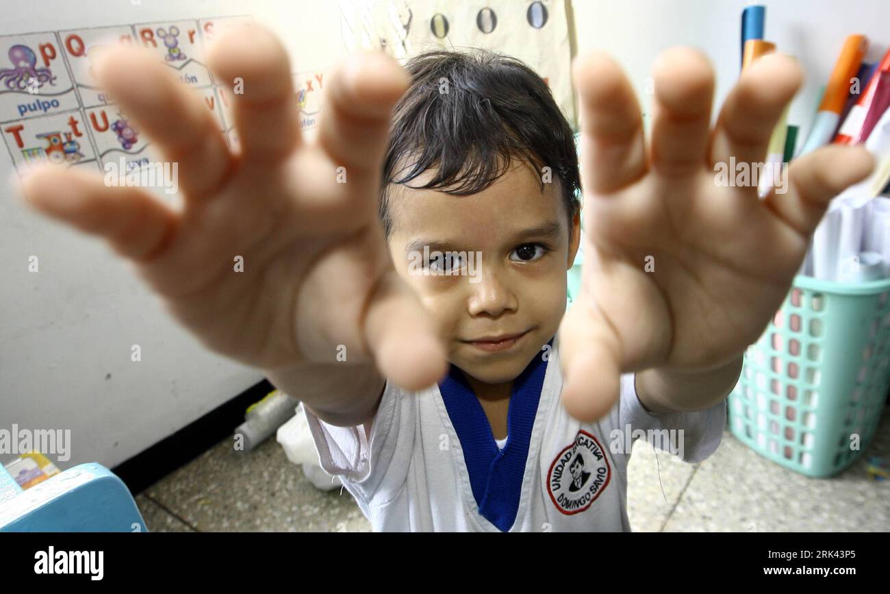 Bildnummer: 53584903  Datum: 30.10.2009  Copyright: imago/Xinhua (091107) -- BARQUISIMETO, Nov. 7, 2009 (Xinhua) -- Jose Manuel Sanchez Aguero, a five-year-old boy, performs magic at home in Barquisimeto, Venezuela, Oct. 30, 2009. Jose s father Miguel Angel Sanchez is a technician and a part-time host for children s parties, which sets a good example to his son. Although quiet and shy in class, Jose now has learnt to perform magic and dancing in children s parties. Michael Jackson is Jose s favorite idol and he is quite up on imitating the pop star. I ll be as famous as Michael sooner or later Stock Photo