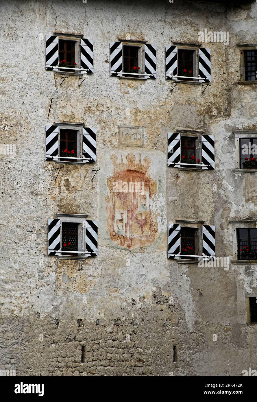 Faded coat of arms and date of 1570 commemorate the extensive rebuilding in Renaissance style of Predjama Castle in south-west Slovenia, an impregnable medieval Gothic fortress constructed in the mouth of a cavern. Stock Photo