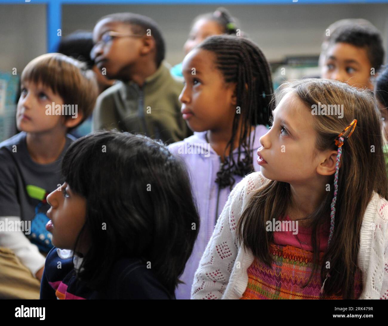 Children talking to each other in class hi-res stock photography and ...