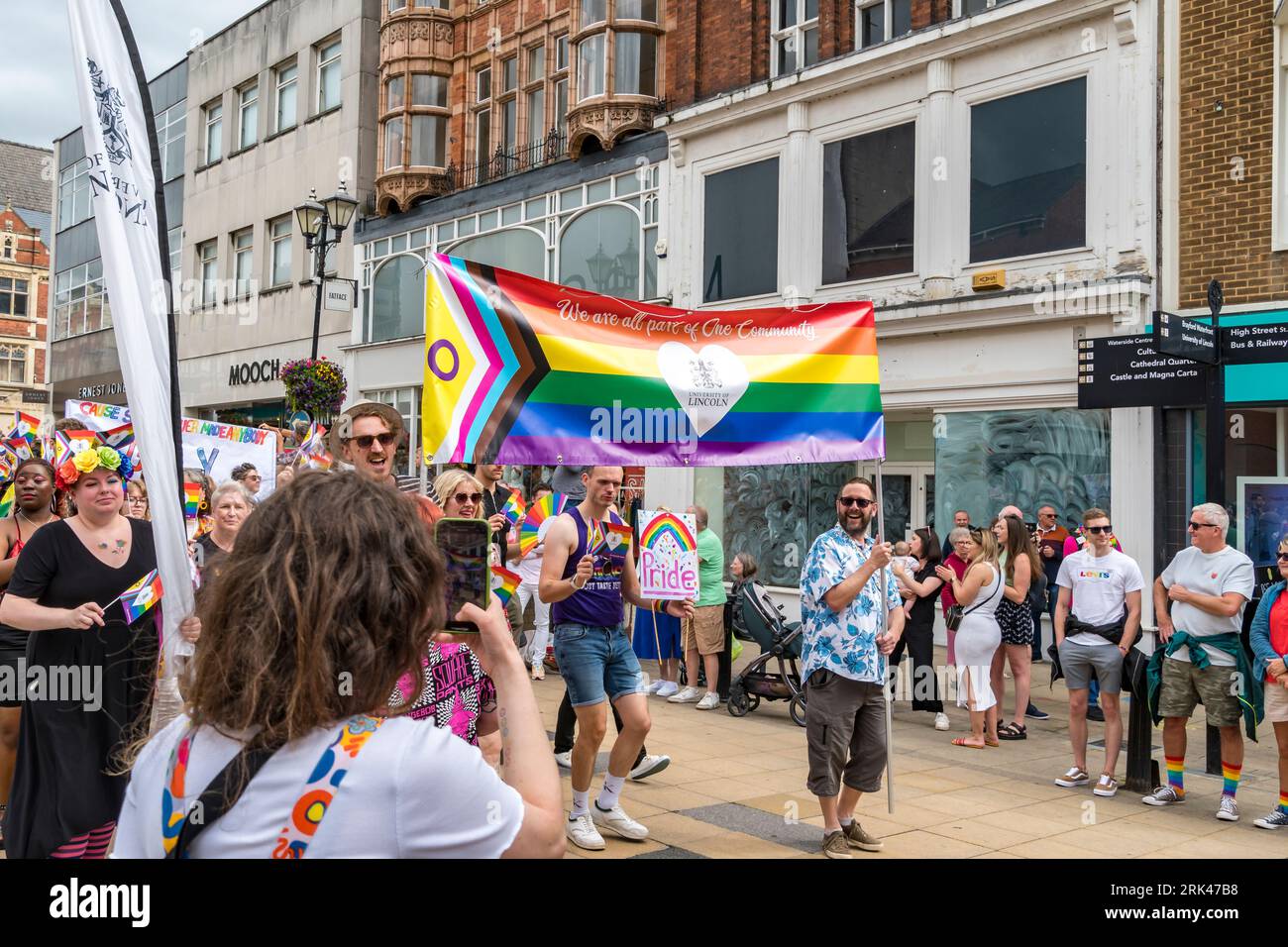 University of Lincoln Pride banner in parade, High Street, Lincoln City ...