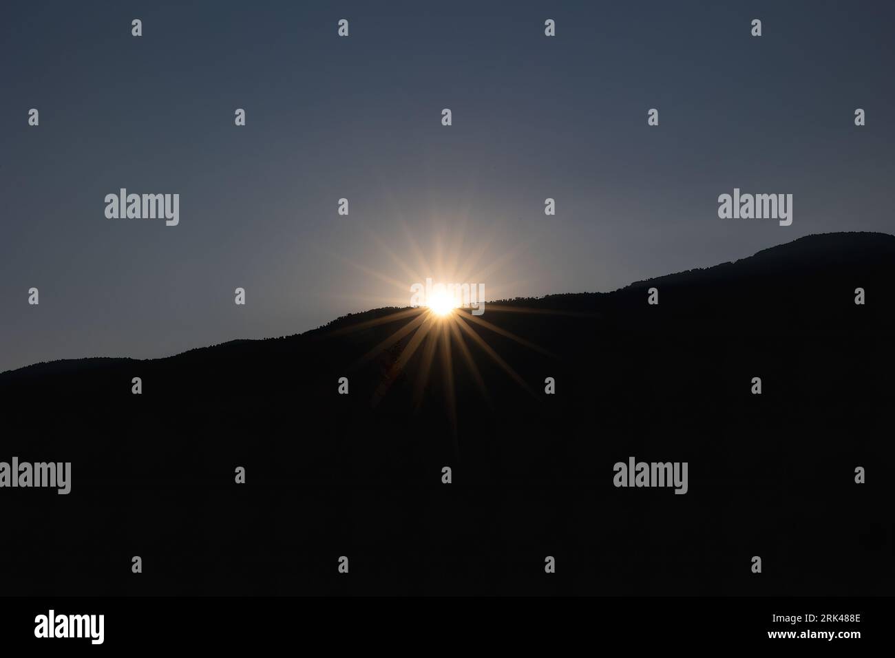 Sun setting behind range hi-res stock photography and images - Alamy