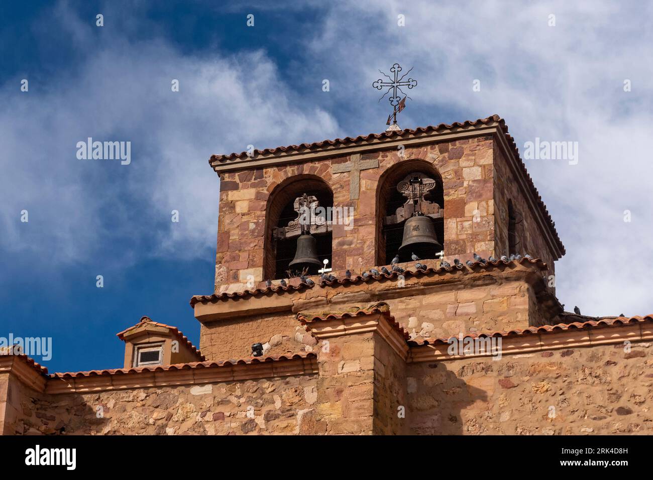 This stunning photograph captures the beauty and grandeur of the Campanario (bell tower) of the Iglesia de Nuestra Señora de la Asuncion in Borobia Stock Photo