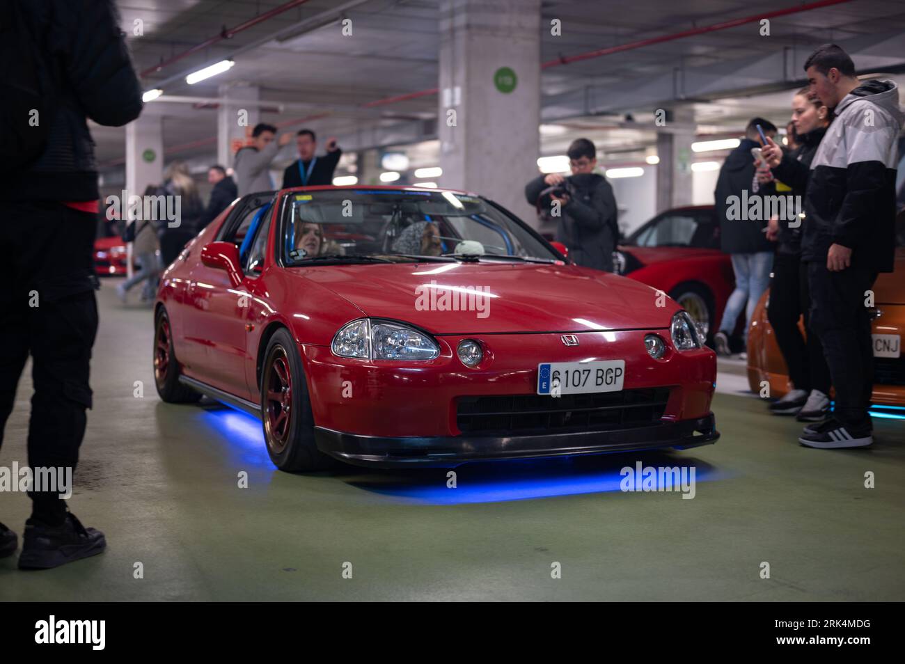 Front view of a red with blue neon Honda Civic CR-X Del Sol tuned by Mugen at a parking rally Stock Photo