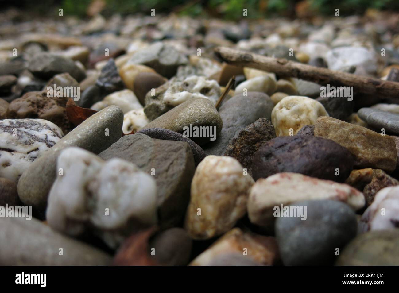 A close-up shot of a pile of rocks in different shades of grey and ...