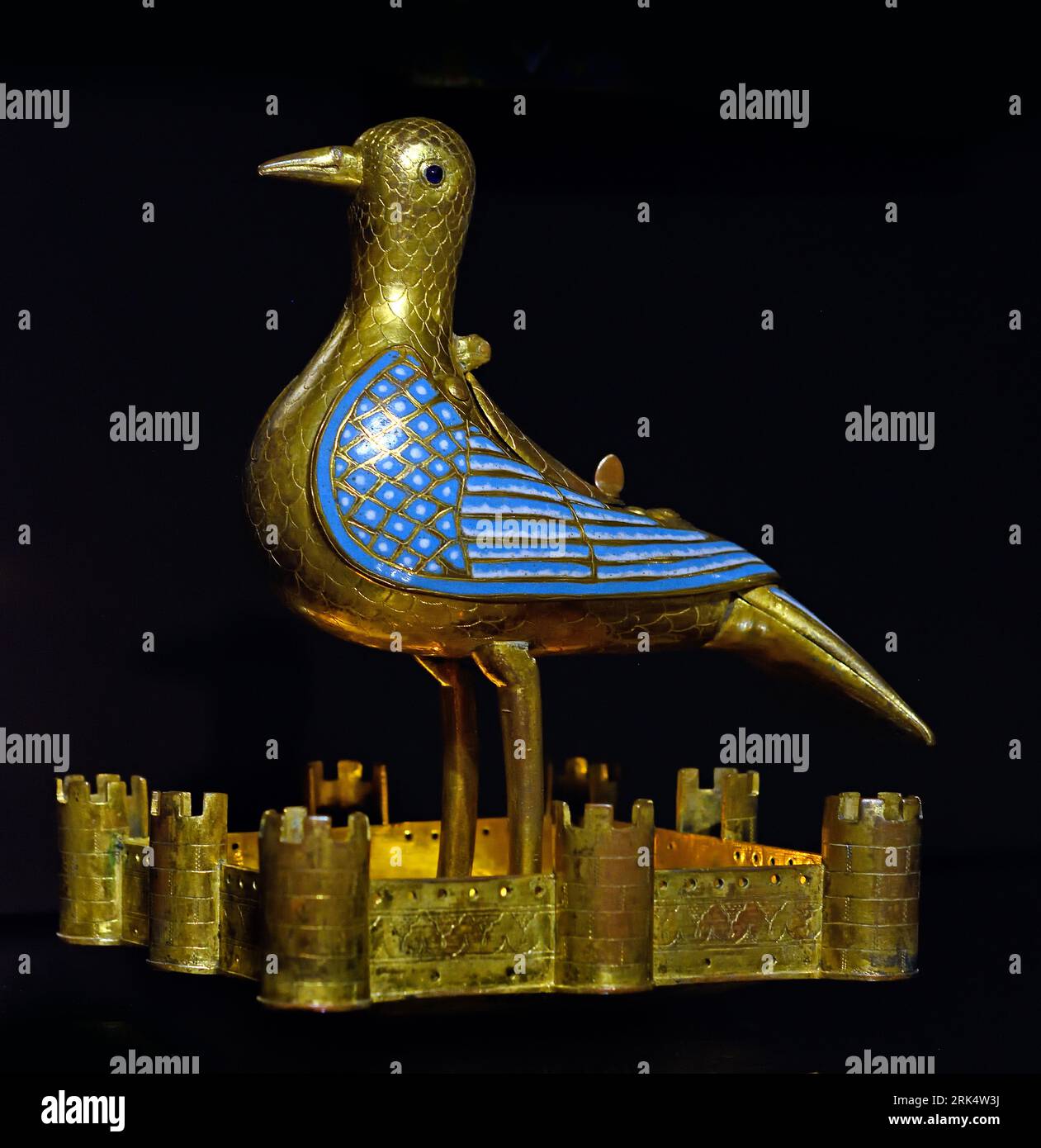 Dove, anonymous, 1225 - 1250, gilding, 22.0cm × 15.9 × 17.9, France, French, (Limoges,  1225–1250, gilded copper, enamel, Communion hosts, were kept in this dove, which was suspended on a chain above , altar as a symbol , Holy Ghost, Eucharistic dove of gilded copper and enamel champlevé, Enamelled are the wings, tail and midfield of the square bowl surrounded ,walls with eight towers in which the pigeon stands ,On the back of the bird a heart-shaped lid, Under the bottom of the bowl an engraved cross,  pigeon, Stock Photo