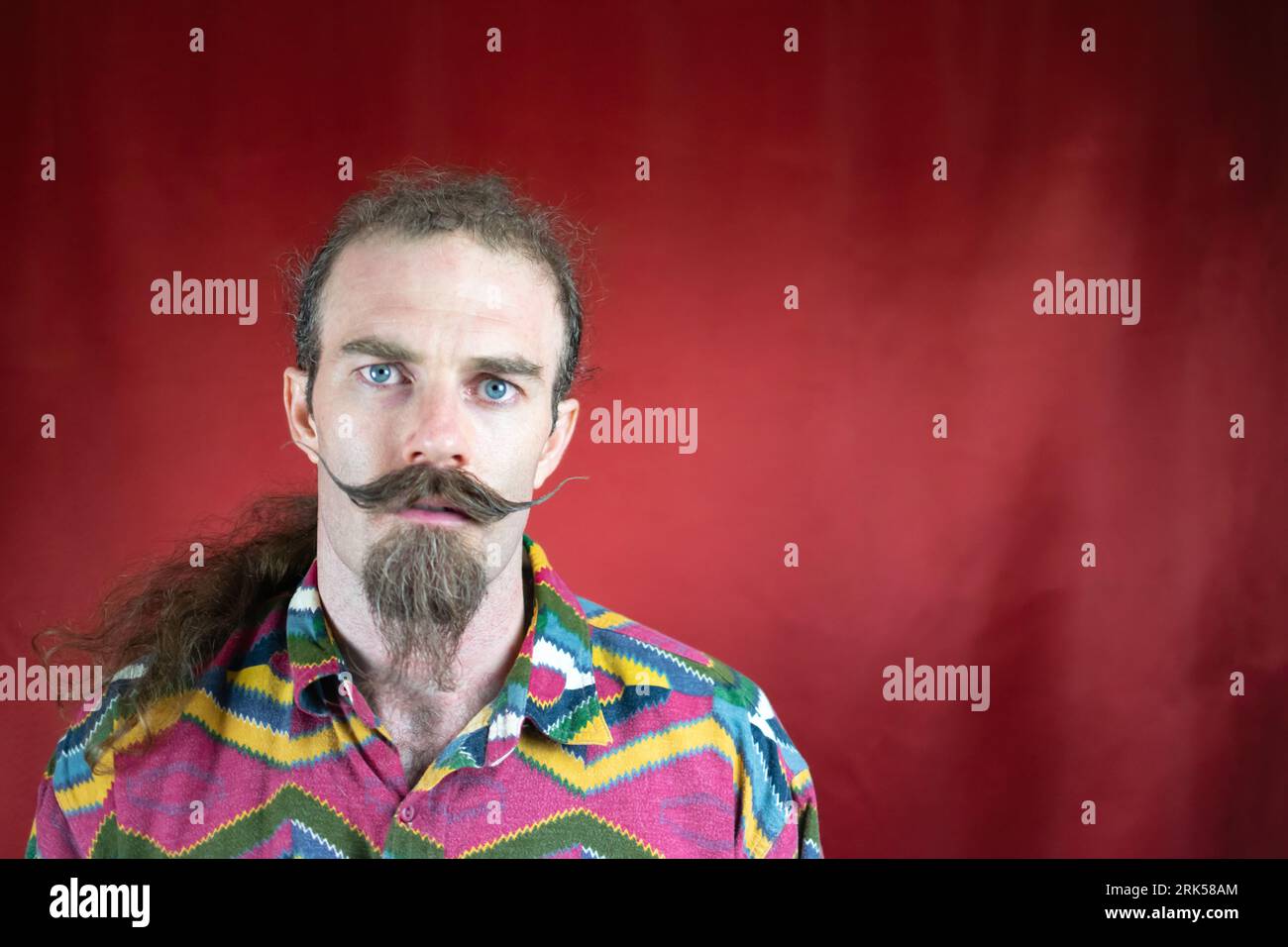 Hipster man with mustache, and expression of not understanding and