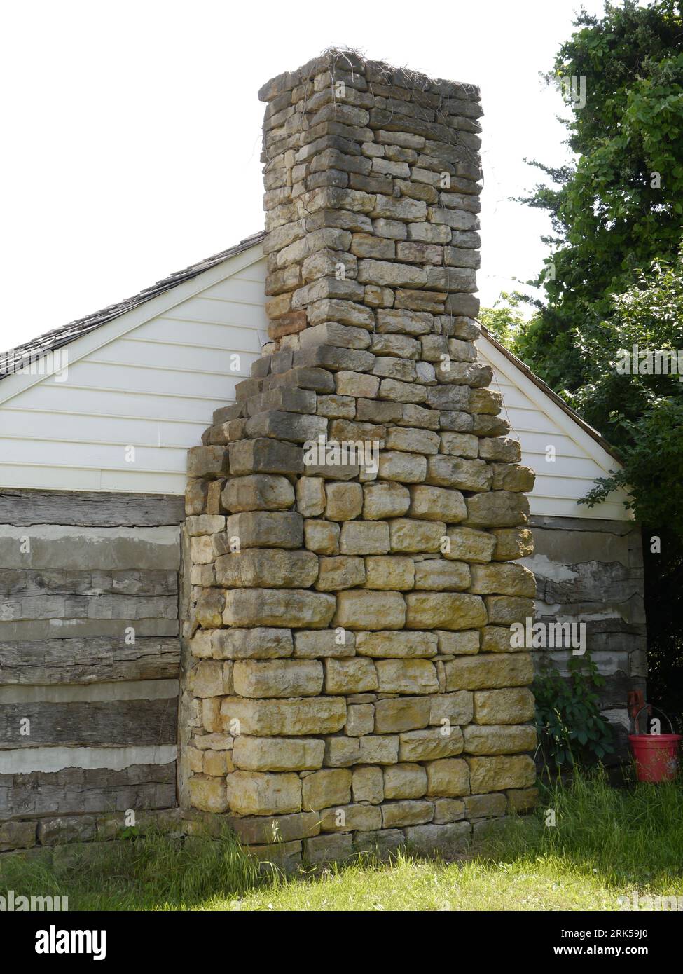 A natural stone chimney on a farmhouse fireplace in Missouri. Stock Photo