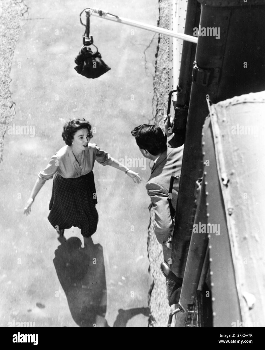 JEAN SIMMONS and ROCK HUDSON on set location candid filming with camera