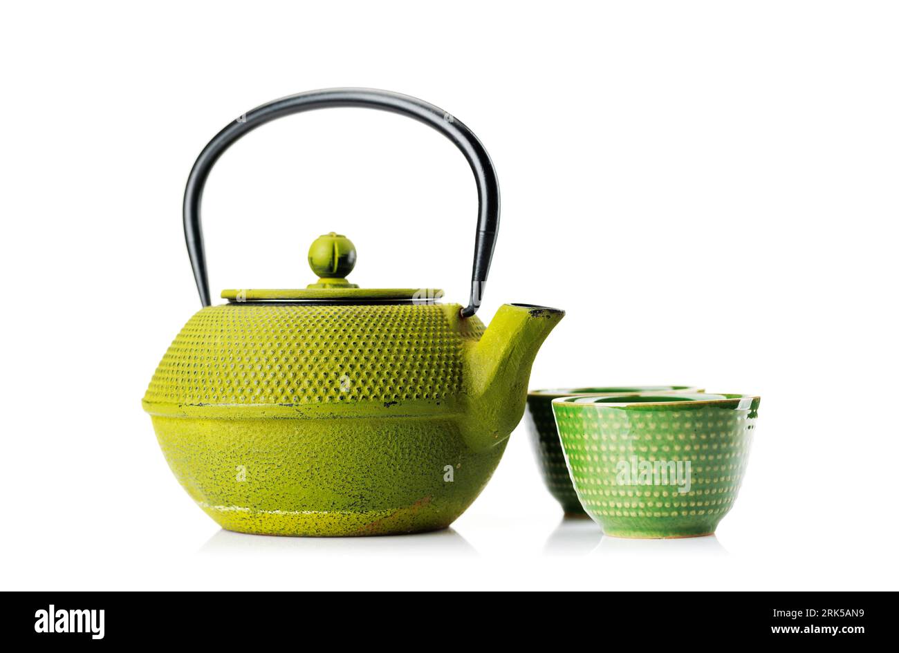 Iron teapot and cups. Isolated on white background Stock Photo Alamy