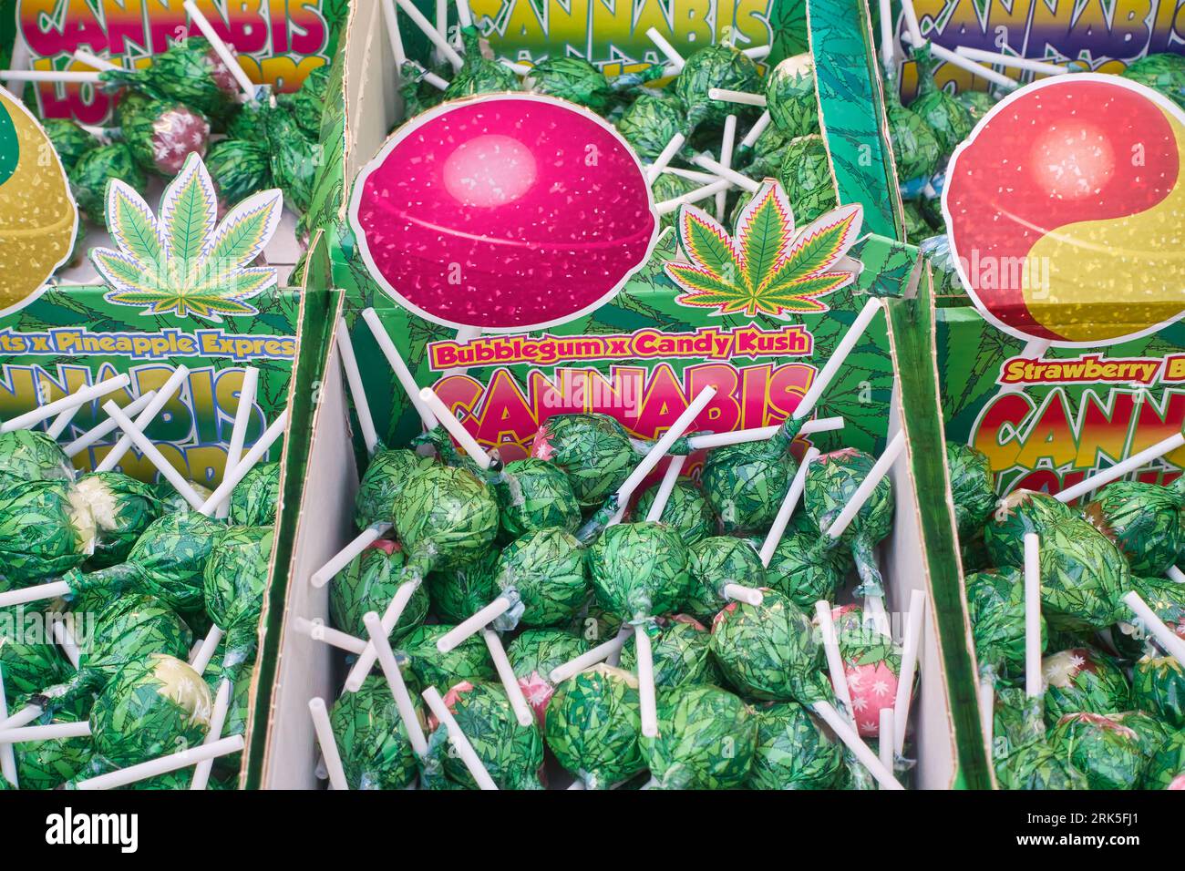 Amsterdam, The Netherlands - August 1, 2023: Lollipops with cannabis and buds of marijuana sold in a tourism store in Amsterdam, The Netherlands Stock Photo