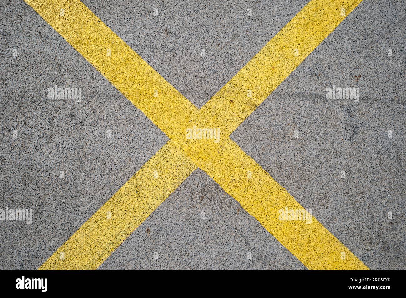 Painted yellow cross, road markings. Stock Photo