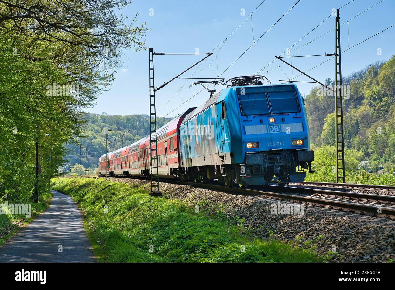 Train traveling through lush green hi-res stock photography and images ...