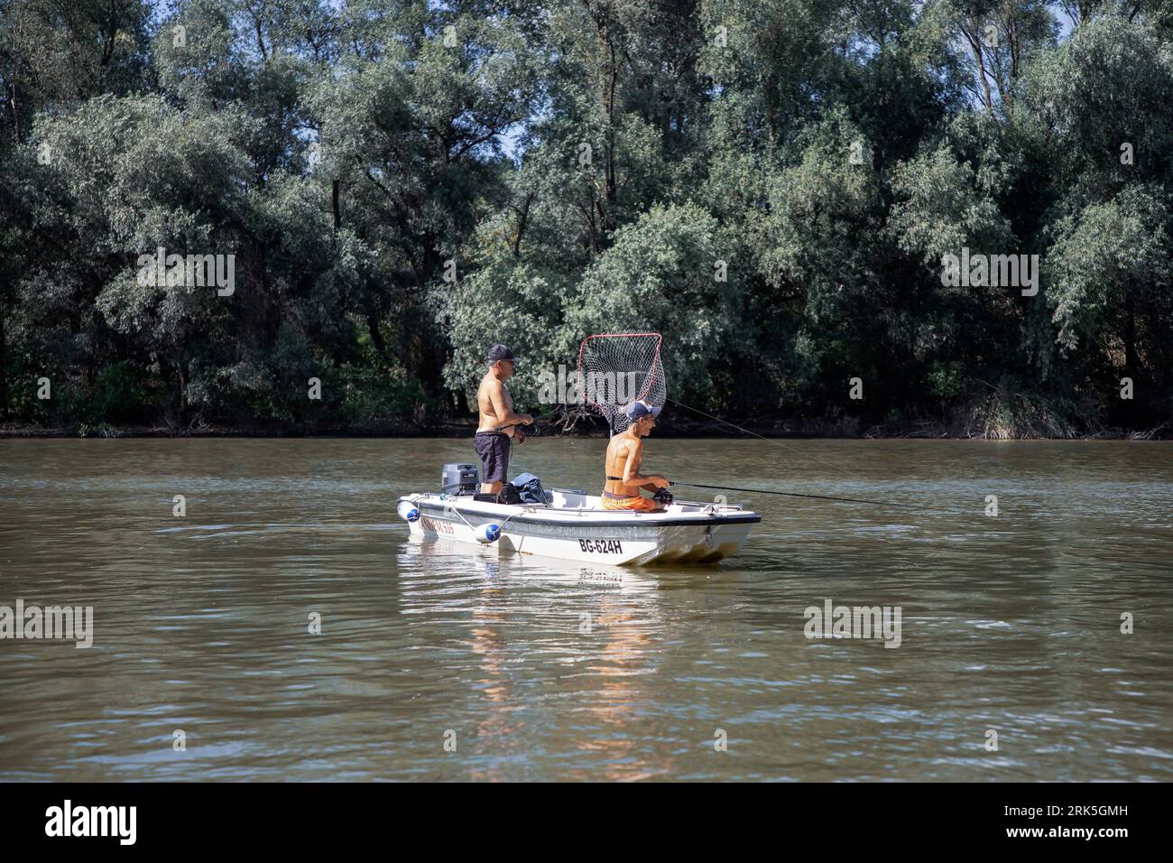 Two men fishing in a boat hi-res stock photography and images - Alamy