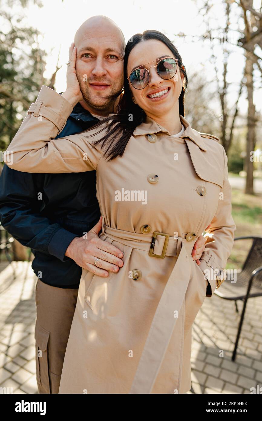 Happy romantic couple enjoying a walk in the park Stock Photo - Alamy