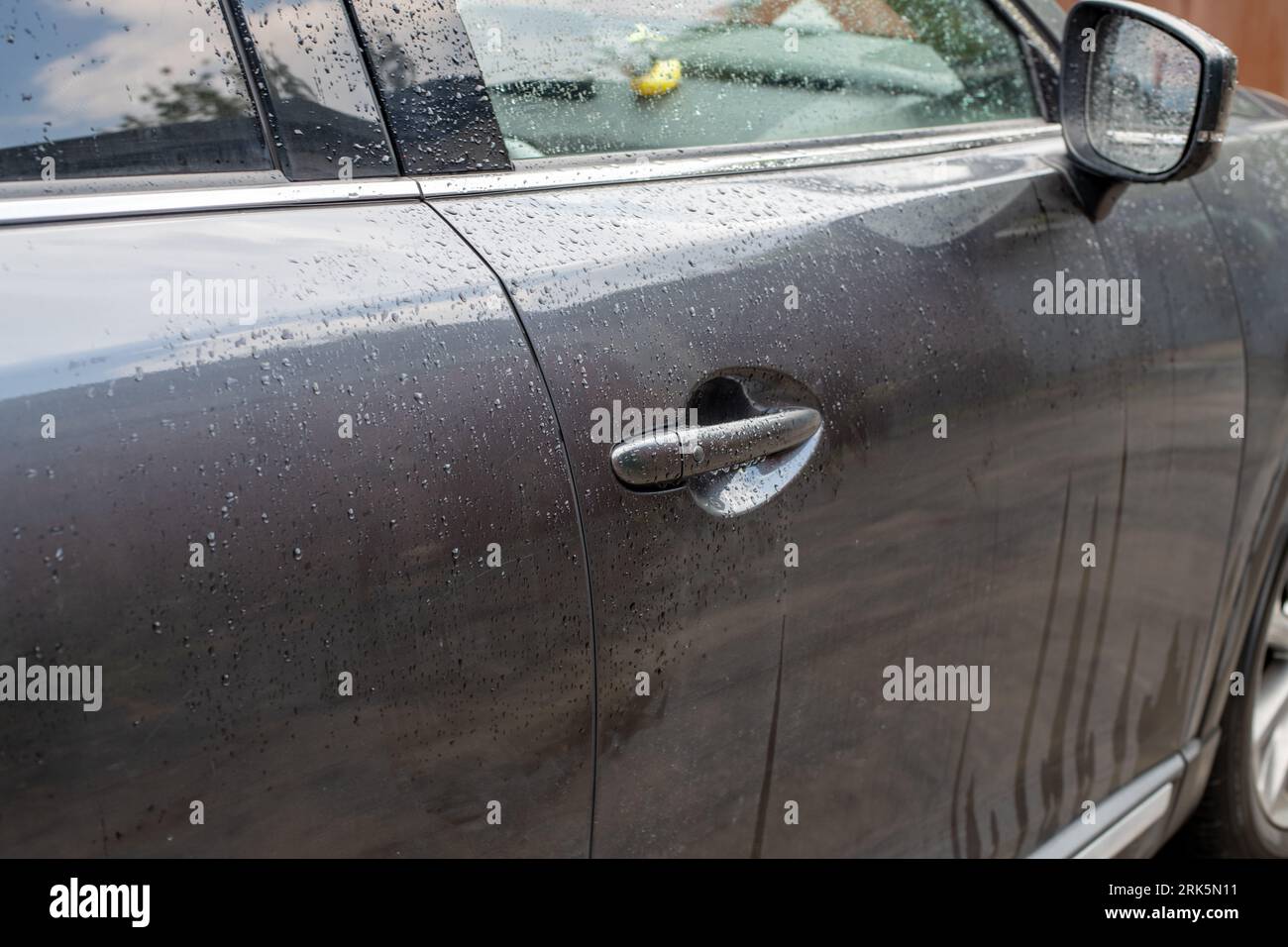 wet car door after rain or washing Stock Photo Alamy