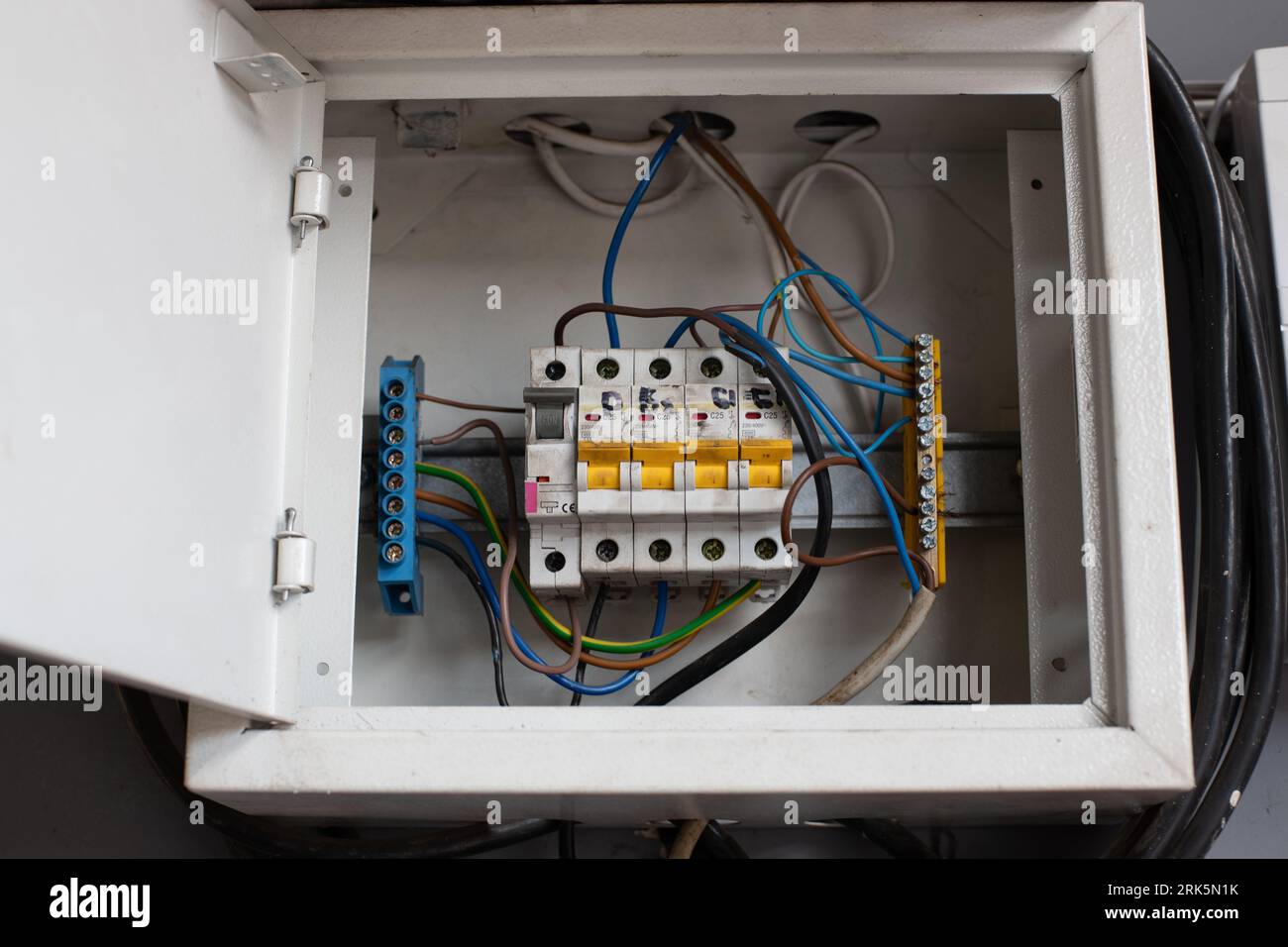 Electrical panel board with accessories such as, contractor, connector, elcb three phase and overload relay, colour cables. Stock Photo