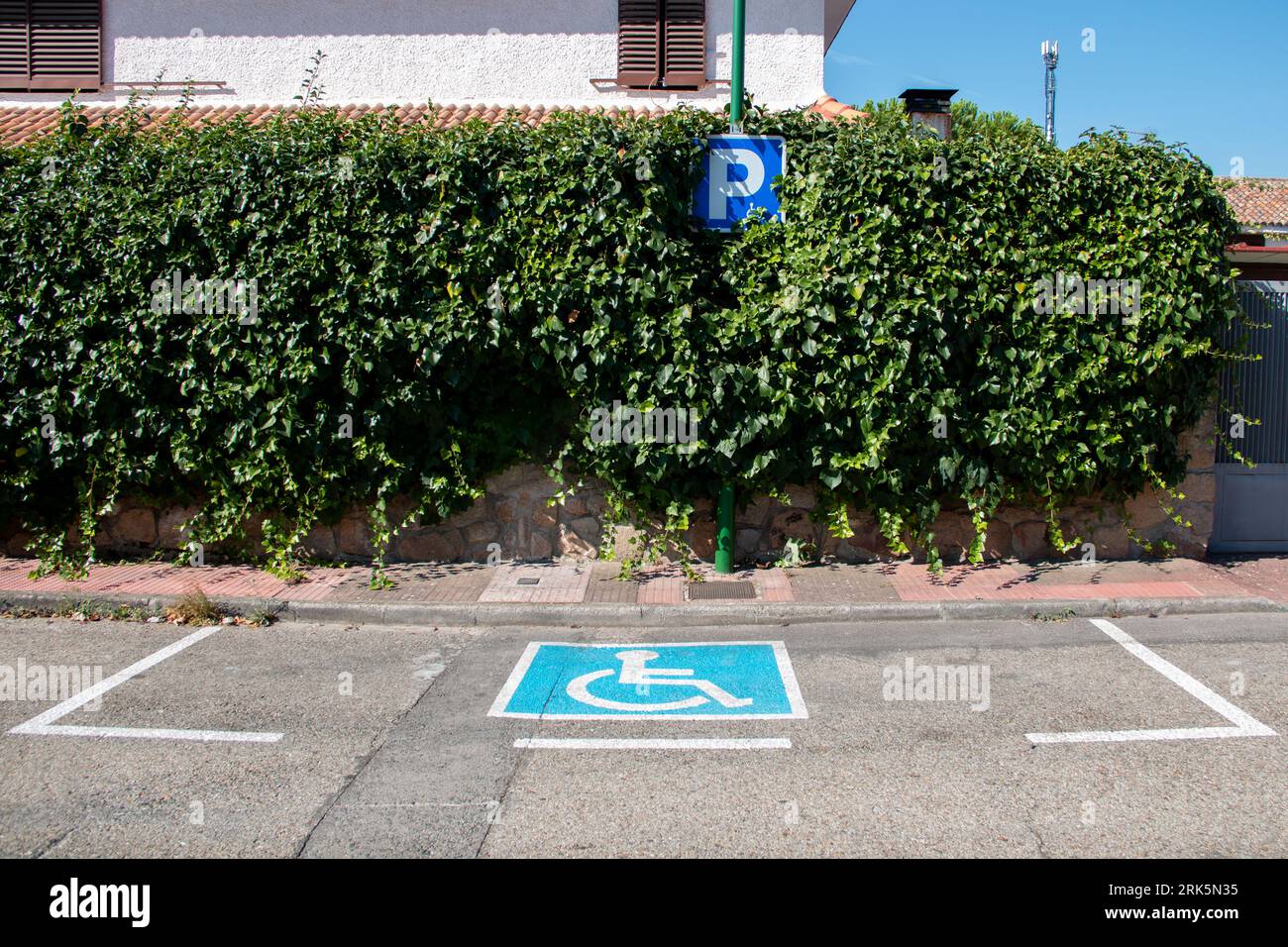 Sign for the disabled and reserve your parking space as well as the access ramp to buildings Stock Photo