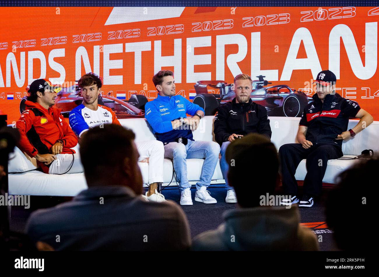Zandvoort, Netherlands. 24th Aug, 2023. ZANDVOORT - (FLR) Carlos Sainz (Ferrari), Pierre Gasly (Alpine), Logan Sargeant (Williams), Kevin Magnussen (Haas F1 Team) and Zhou Guanyu (Alfa Romeo) during the track press conference at the Zandvoort Circuit prior to the F1 Grand Prix of the Netherlands on August 24, 2023 in Zandvoort, Netherlands. ANP REMKO DE WAAL Credit: ANP/Alamy Live News Stock Photo