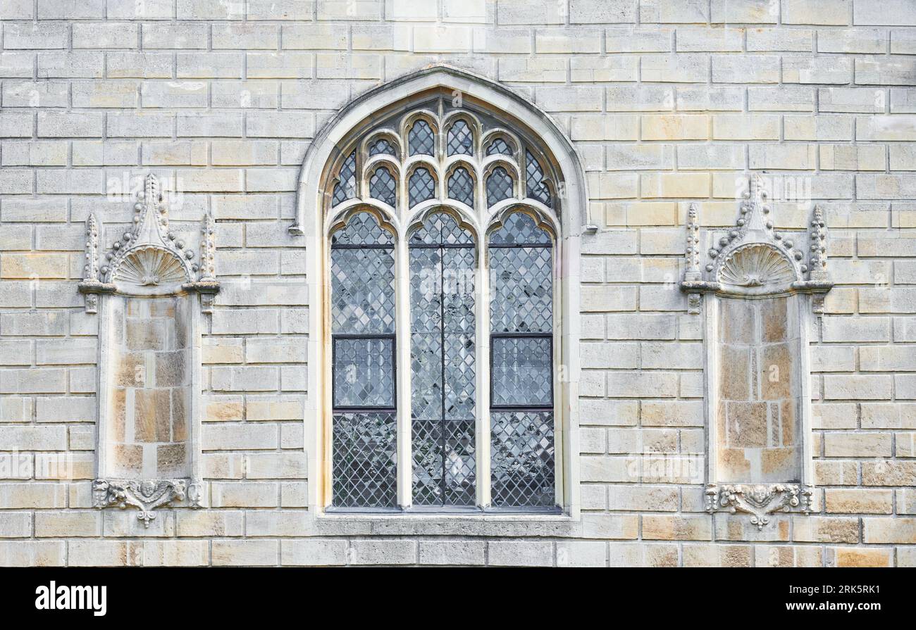 Chapel window flanked by empty niches at Peterhouse, dating from the 13th century, the oldest of the Cambridge University colleges, England. Stock Photo