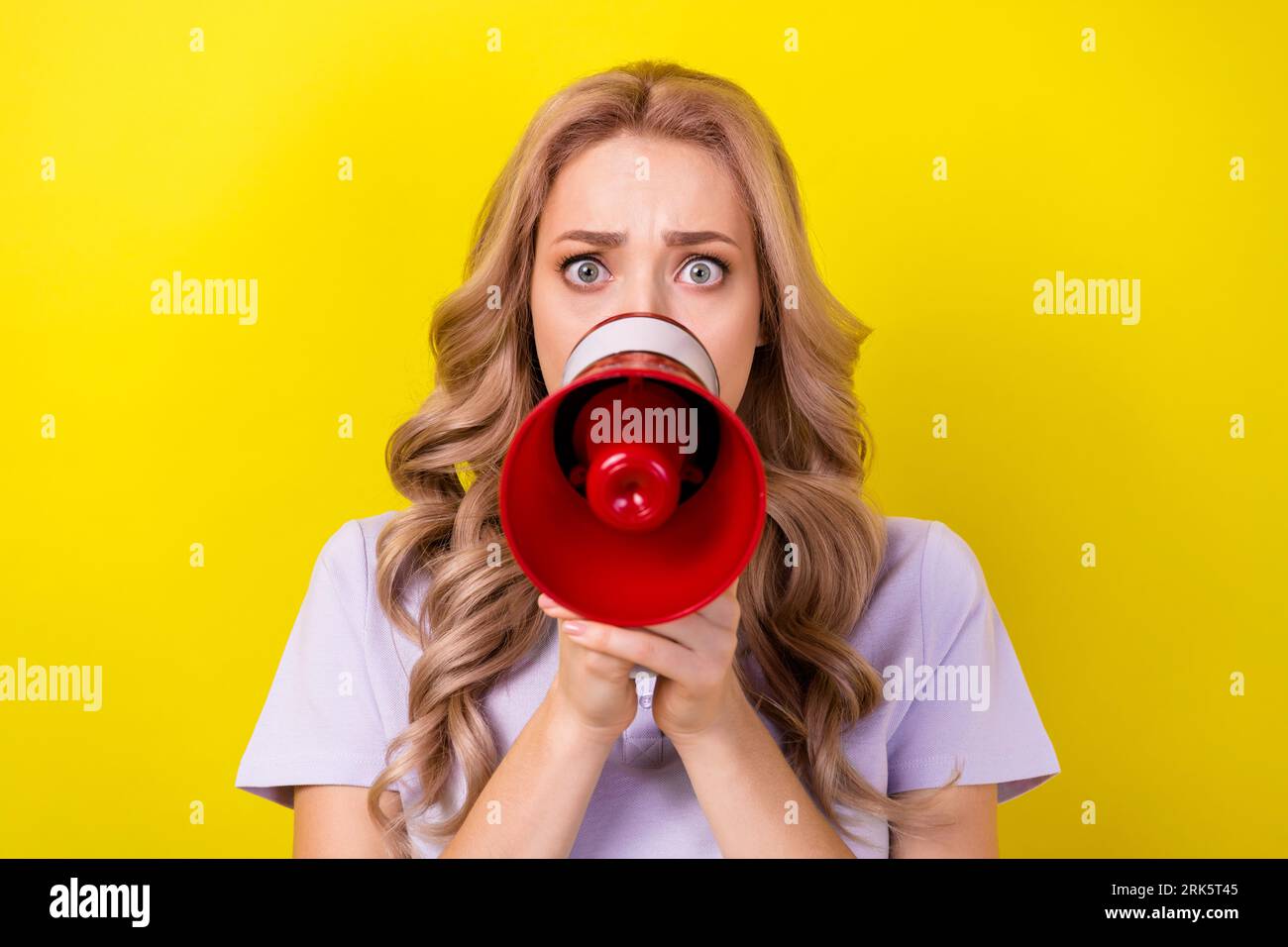 Photo of scared impressed woman dressed violet tshirt screaming loud