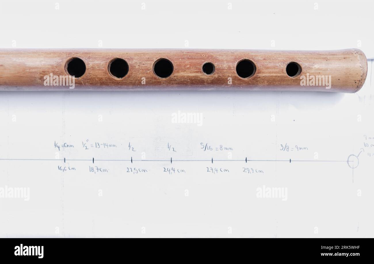 wooden flute quena holes on paper with their measurements Stock Photo