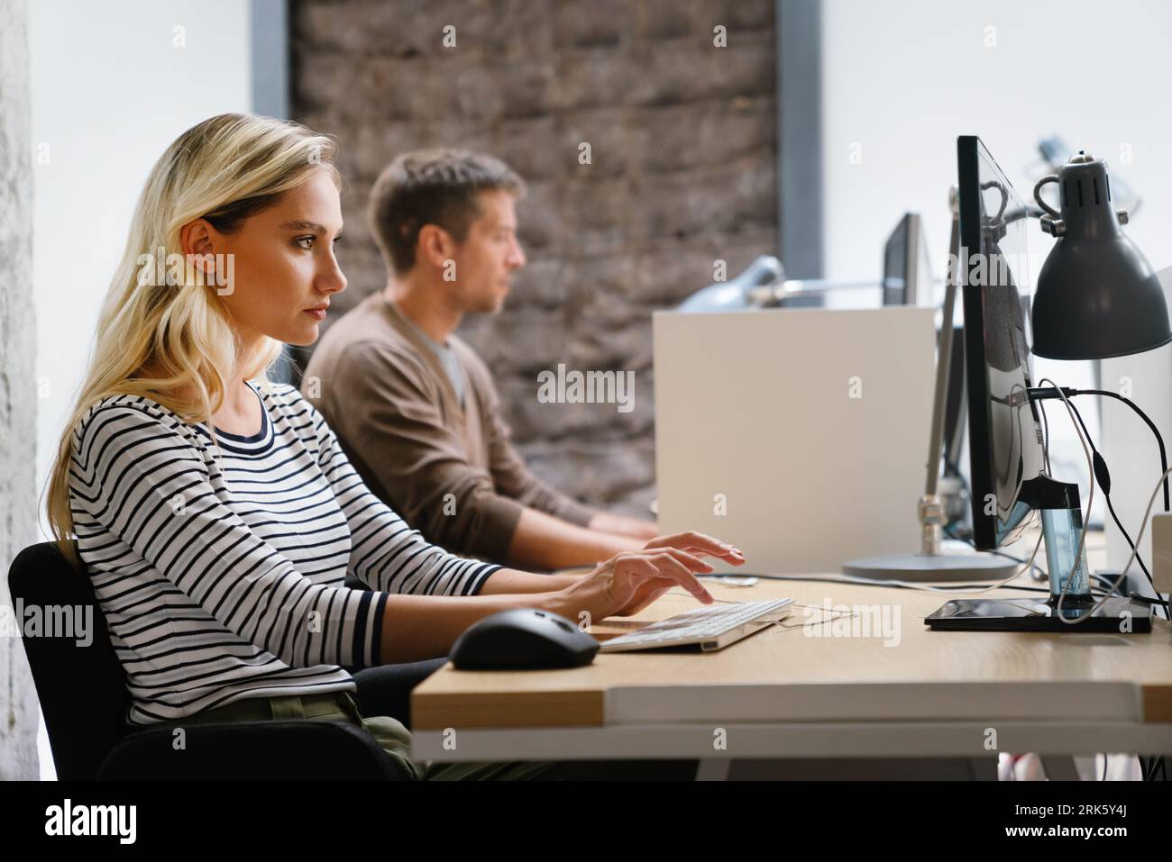 Software engineers working on project and programming in company. Business people concept. Stock Photo