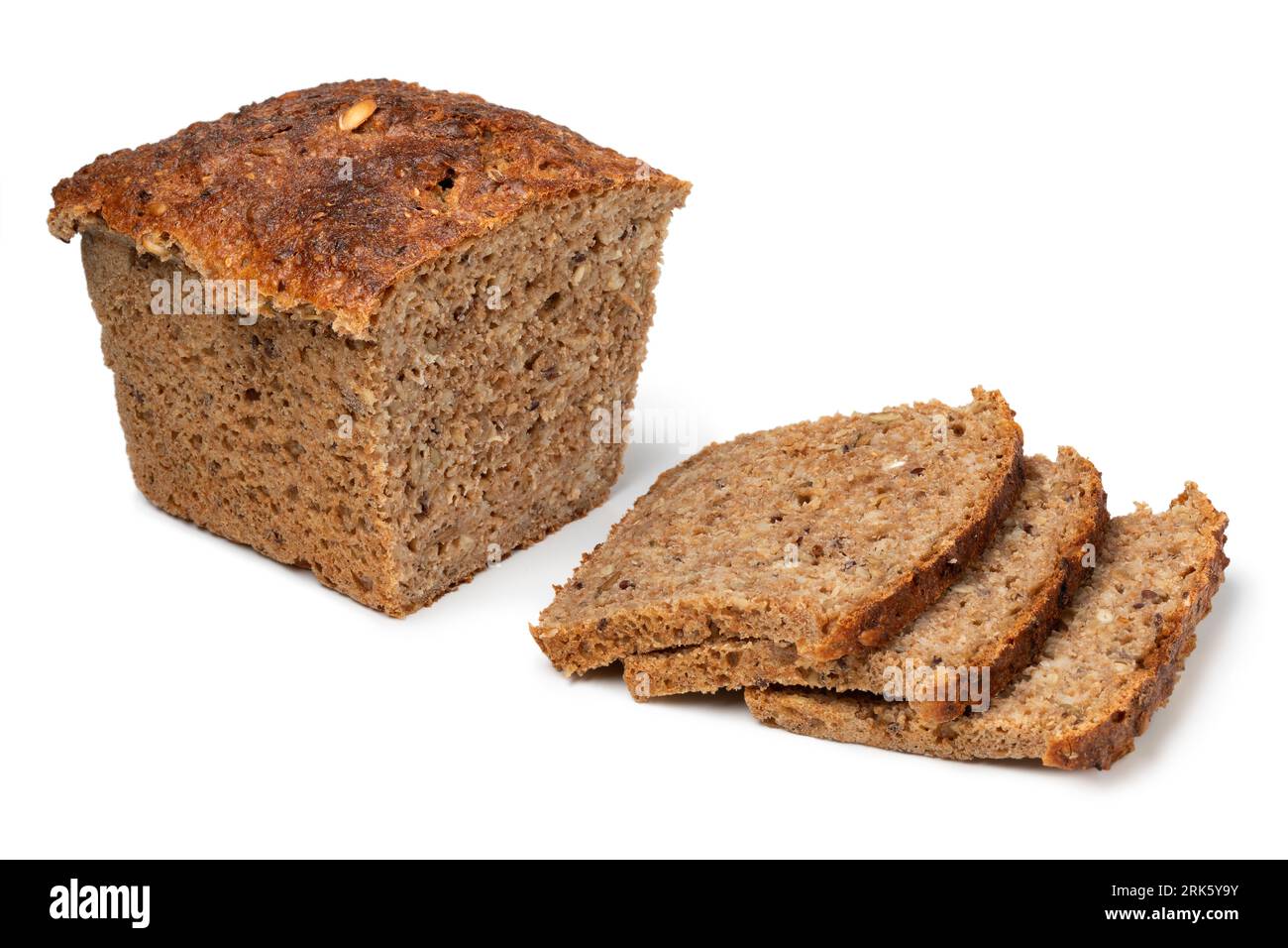 Fresh Scandinavian loaf and slices of sourdough spelt bread with a variation of seed close up isolated on white background Stock Photo