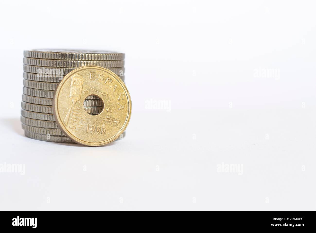 A closeup of an Old spanish peseta coin on a white backgroun Stock Photo