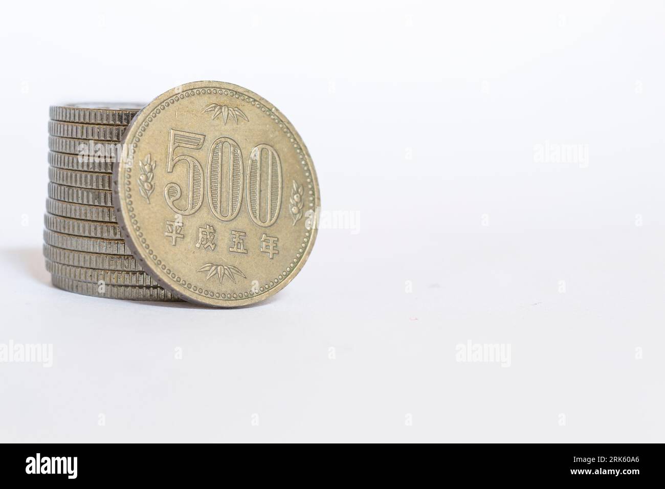 A closeup of a 500 yen japanese coin on a white background Stock Photo