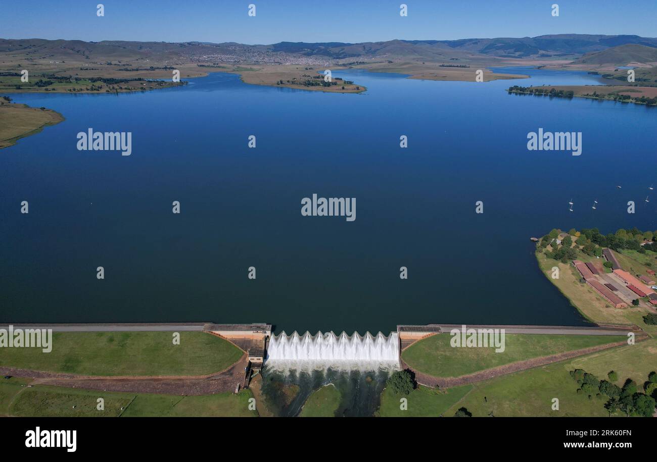Panoramic view of water flowing over the Midmar Dam Wall in KwaZulu Natal - South Africa Stock Photo