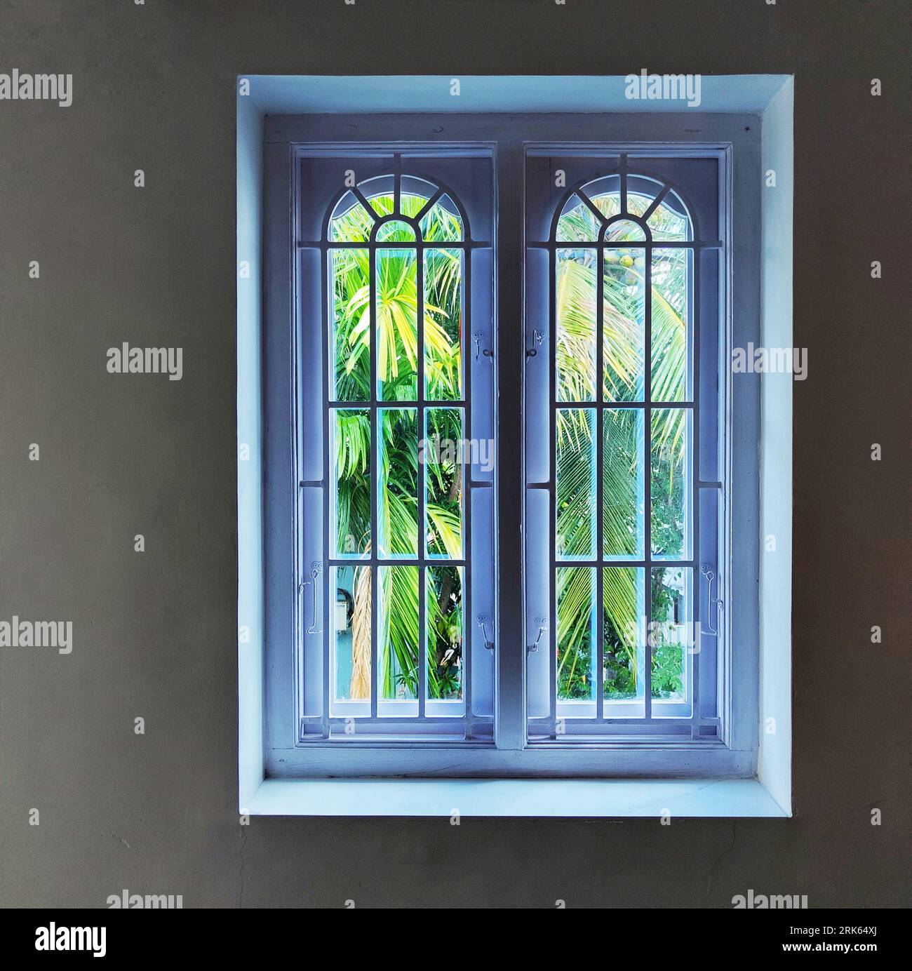 A still image of a room interior, featuring a window with a reflection ...