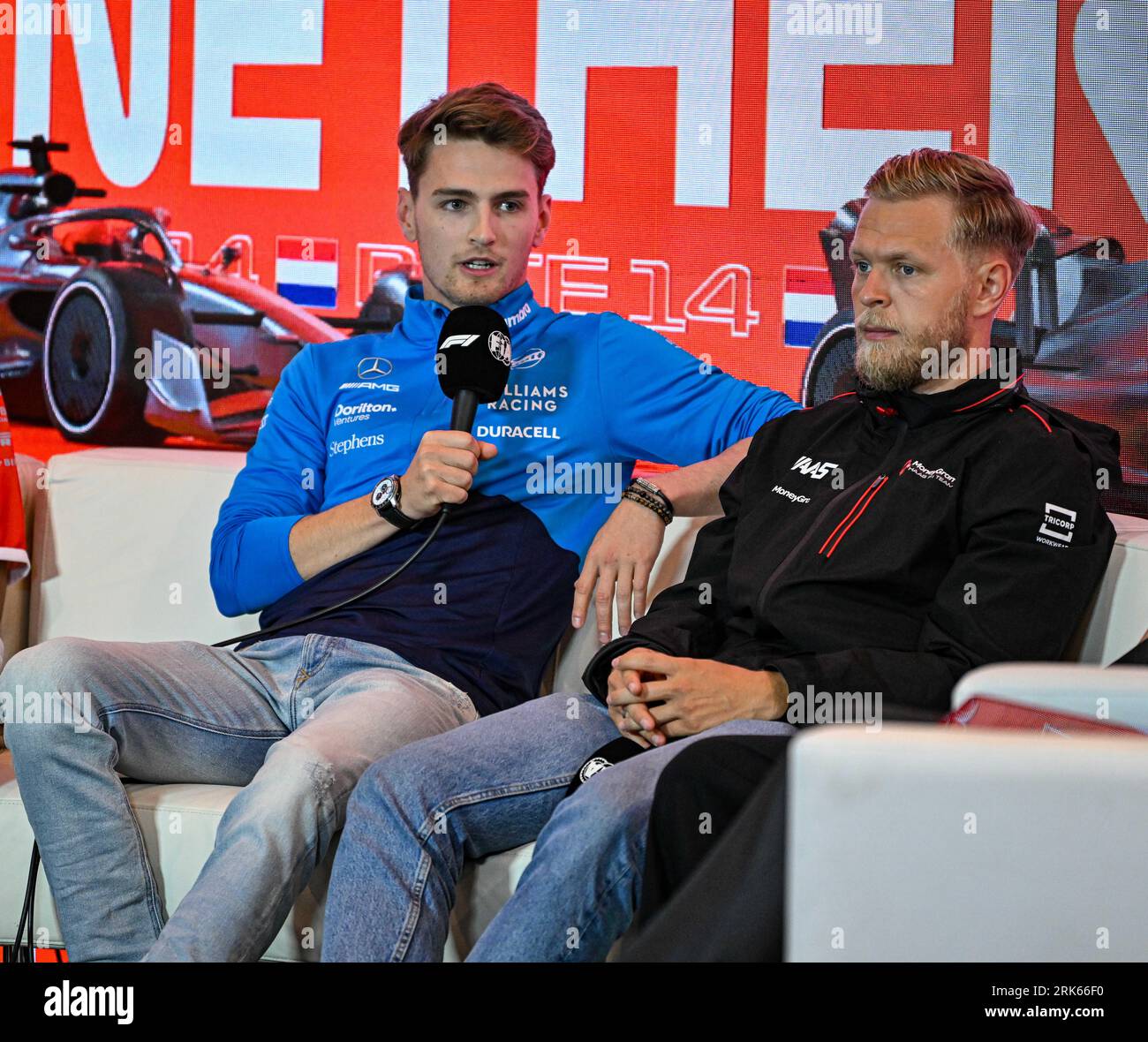 Zandvoort, Netherlands. 24th August 2023; Circuit Zandvoort, Zandvoort, North Holland, Netherlands; Formula 1 Heineken Dutch Grand Prix 2023; Arrivals and Inspection Day; Logan Sargeant (USA) answers questions in the drivers press conference as Kevin Magnussen (DEN) listens Credit: Action Plus Sports Images/Alamy Live News Stock Photo